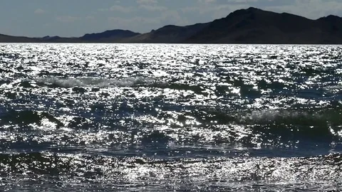 The slow movement of the waves in the light of the setting sun. Stock Footage 79130929