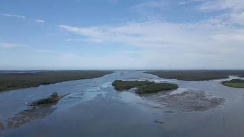 Slow moving aerial shot over island Stock Footage