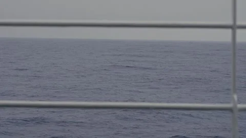 Slow Moving Antarctic Ocean Waves Seen Through Ship Railing on Drake Passage Stock Footage 332375617