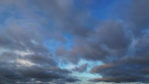 Slow Moving Clouds in Blue Sky Stock Footage 324790580