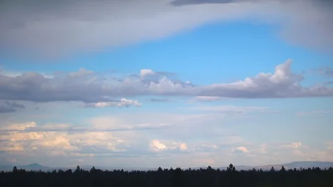 Slow Moving Clouds over the Forest Stock Footage 90494089