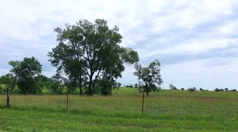 Slow moving clouds pass over a Missouri farm Stock-Footage 40075165