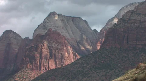 Slow moving clouds pass over Zion National Park after a brief rain 스톡 동영상 55738632
