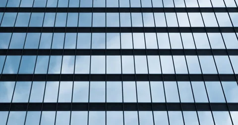 Slow moving clouds reflected in office windows Stock Footage 60850906