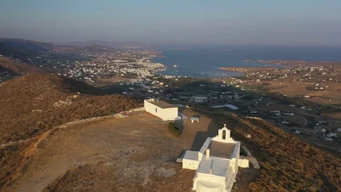 Slow moving drone shot over whitewashed churches on island of Paros Stock Footage 121801695