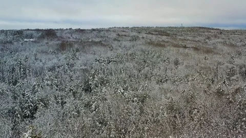 Slow moving drone shot over winter landscape with cell tower Stock Footage 127310415