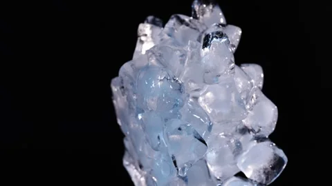 Slow moving melting ice pile with dripping water on black background for dr.. Stock-Footage 345089919