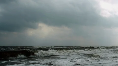 Slow-moving Ocean Waves in overcast weather Stock Footage 107988445