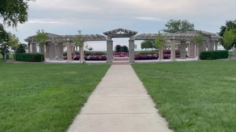 Slow Moving pan forward to a center flower garden lake Michigan in a Kenosha Video stock 163840821