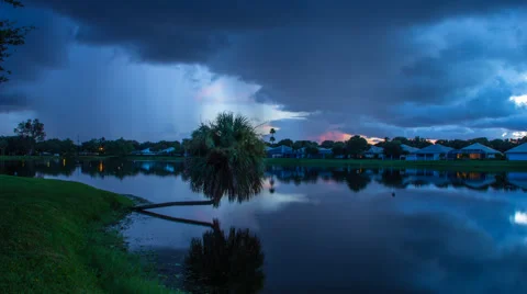 Slow Moving Storm Cloud Over Lake with Waterfront Homes Stock Footage 42842693
