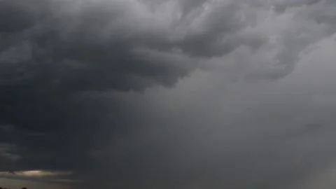 Slow moving thick clouds, thunder and flying bugs HD Stock Footage 134737646