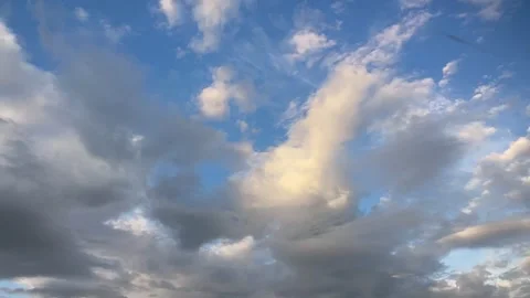 Slow moving timelapse clouds moving away, gold highlight center Stock Footage 286167600