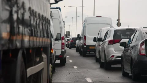 Slow moving traffic jam at rush hour on a busy main road Stock Footage 166163964