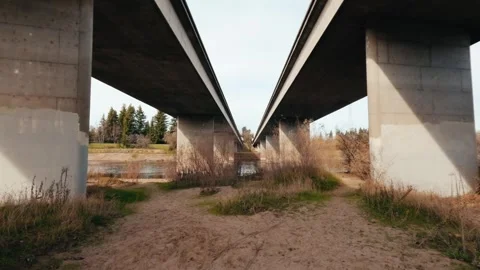Slow moving under a bridge over a river Stock Footage 296793762