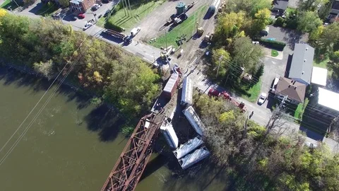 Slow moving vertical shot above scene of train derailment Stock Footage 82130103