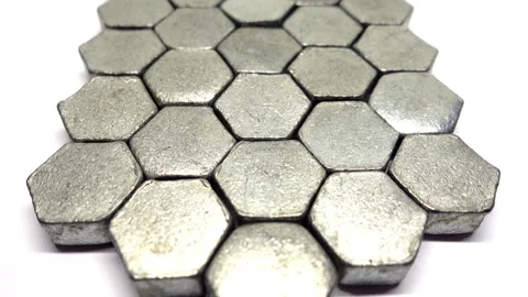 Slow moving view above a pattern of metal hexagons. Stock Footage 331229902