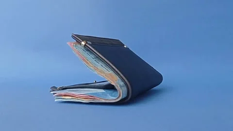 Slow moving wallet close because full of Indonesian money Stock Footage 151024973