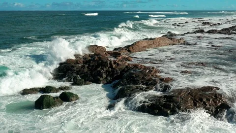 Slow: Ocean waves crashing down on rocks Stock Footage 127242991