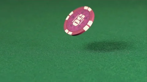 SLOW: One playing chip fall on a green table Видео 58606166