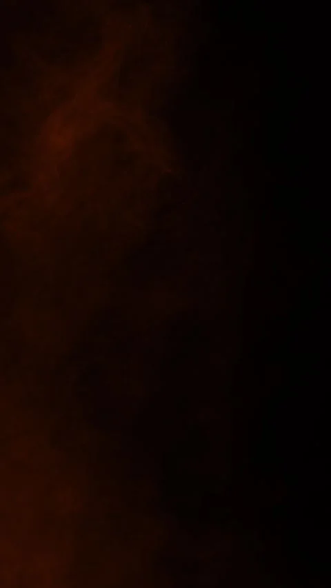 Slow orange ember smoke on black background, vertical format Stock Footage 340131519