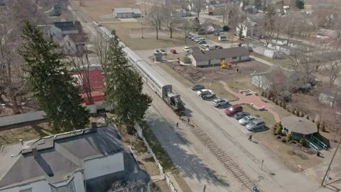 Slow Orbit Around Stopped Train in Rural America Stock Footage 154973306