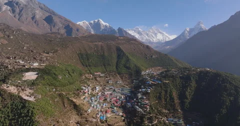 Slow orbit drone shot of Namche Bazaar Everest,town revealing terraced slopes Stockbeeldmateriaal 337394025