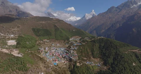 Slow orbit drone view of Namche Bazaar Nepal with Ama Dablam mountain background Video stock 337394140