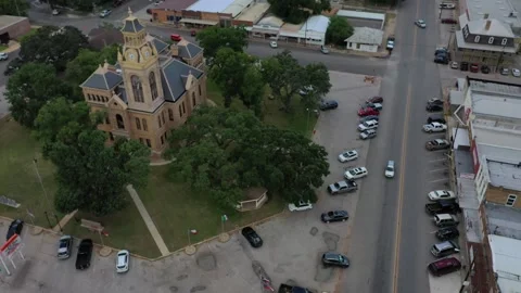 Slow orbit of octagonal town square, and courthouse, Llano, Texas, USA Stock Footage 142108750