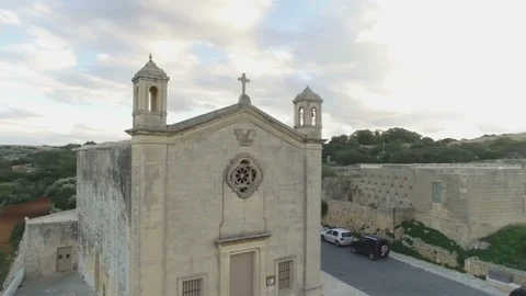 Slow orbit shot around St Matthew's Chapel in Qrendi Stock Footage 92074389