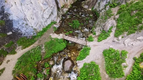Slow Orbit Of Small River Bridge inside Cavern Stock-Footage 289576169