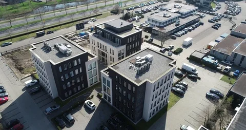 Slow orbit of three small office buildings Stock Footage 90018173