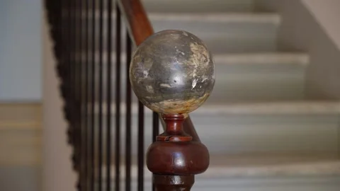 Slow orbiting shot of a marble ball handrail on a staircase within a villa 動画素材 275249823