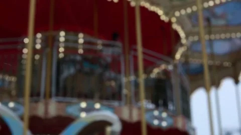 Slow, out of focus lights on a Carousel at night Stock Footage 82442397