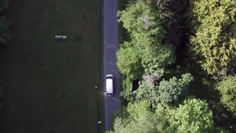 Slow overhead tracking shot of a van Stock Footage 141112341