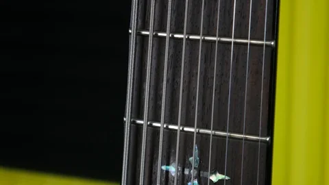 Slow Pan Up 9 String Guitar Fretboard Video stock 96874537