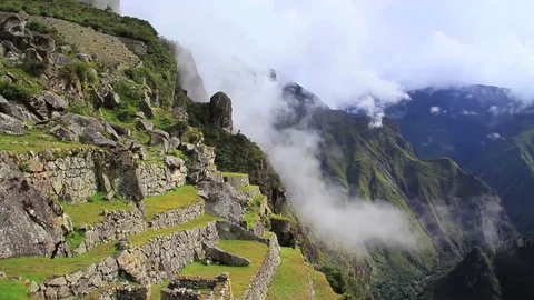 Slow Pan Across the Cloudy Surrounding Mountains of Machu Picchu Stock Footage 84292381