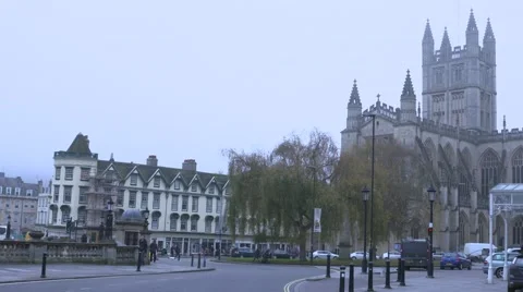 A slow pan across a distant view of Bath cathedral. Video stock 61796595
