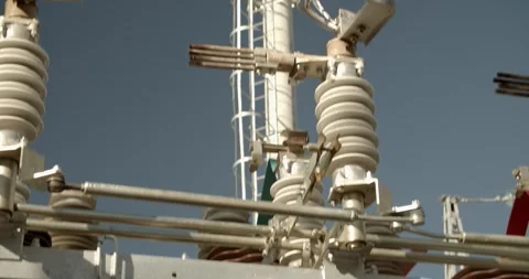 Slow pan across electricity grid infrastructure and metal structures Vídeos de archivo 328883281