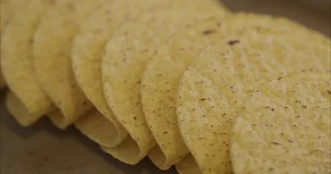 Slow pan across hard shell corn tortillas for tacos Stock Footage 155546924
