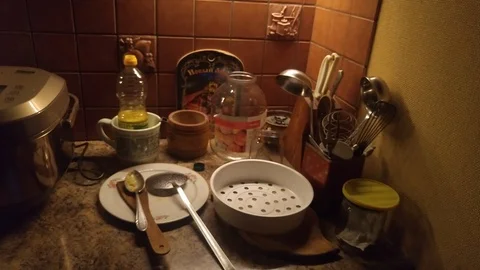 A slow pan across a kitchen at night. Video stock 89801761