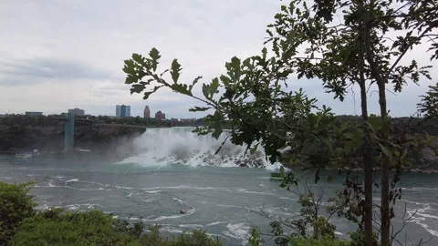A slow pan across the Niagara gorge from the Horseshoe Falls and its mist Stock Footage 345996082