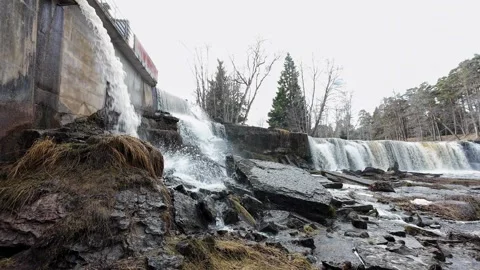Slow pan across a rocky waterfall from river level Stock Footage 337554335