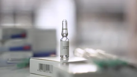 Slow Pan Across Testosterone Ampoule on Table Stock Footage 327477394