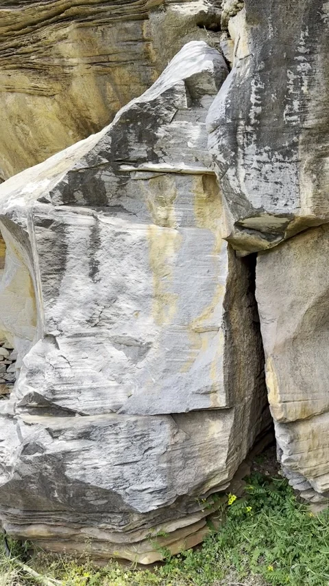 Slow Pan Along Layered Rock Formation and Rustic Stonework Stock Footage 336964919