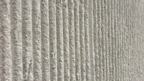 Slow Pan Along Vertical Off White Stone Texture Wall Abstract Background Stock Footage 331061720