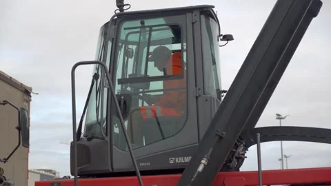 Slow pan arc Shot Kalmar Reach Stacker Cab Overcast Port Freight Operation Port Stock Footage 338371649