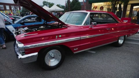 Slow pan around 1960s red Ford Galaxie 500 Stock Footage 239608643