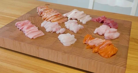 Slow pan around a beautiful presentation of fresh sliced sashimi fish Video stock 115545184