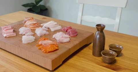 Slow pan around a beautiful presentation of fresh sliced sashimi fish Stock-Footage 115545226