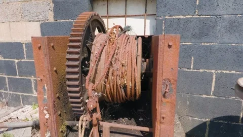 Slow Pan Around Rusted Boat Winch Mechanism on Hastings Beach Stock Footage 340603792